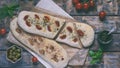 Traditional Italian Focaccia with tomatoes, basil, garlic and sumach. Homemade pastry. Flat bread. Organic flatbread. Rustic style Royalty Free Stock Photo