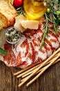 Traditional Italian food, caprese salad made of sliced fresh tomatoes, mozzarella cheese and basil  served on a white plate Royalty Free Stock Photo