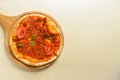 Traditional italian food. Delicious fresh pizza with bolognese sauce, tomatoes, pepper on wooden board, flat lay. Royalty Free Stock Photo