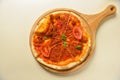 Traditional italian food. Delicious fresh pizza with bolognese sauce, tomatoes, pepper on wooden board, flat lay. Royalty Free Stock Photo