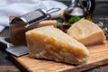 Traditional italian food - 36 months aged in caves Italian parmesan hard cheese from Parmigiano-Reggiano, Italy