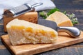 Traditional italian food - 36 months aged in caves Italian parmesan hard cheese from Parmigiano-Reggiano, Italy Royalty Free Stock Photo