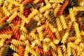 Traditional Italian fusilli tricocolore close up. Background, texture