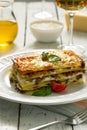 Traditional Italian lasagna made with minced beef. Side view Royalty Free Stock Photo