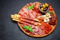 Meat and cheese plate with salami sausage, chorizo, parma and mozzarella