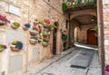 Traditional italian medieval alley and buildings in the historic center of beautiful town of Spello, in Umbria Region, Italy Royalty Free Stock Photo