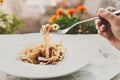 Traditional italian pasta carbonara with bacon and egg on fork Royalty Free Stock Photo