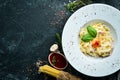 Traditional Italian pasta dish, spaghetti carbonara with yolk, parmesan cheese on a plate. Top view. Royalty Free Stock Photo