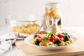 Traditional Italian pasta Pipe Rigate with tomatoes, olives