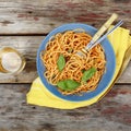 Traditional Italian pasta with tomato sauce and basil and white wine in a glass Royalty Free Stock Photo