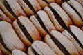 Traditional Italian pastry - krapfen filled with chocolate cream - for sale in Christmas stalls of Milan.