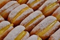 Traditional Italian pastry - krapfen - filled with pasticcera cream made of eggs and sugar - for sale in Christmas stalls of Milan