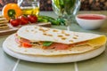 Traditional Italian piadina, grilled with fresh tomatoes, mozzarella, and basil