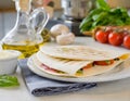 Traditional Italian piadina, grilled with fresh tomatoes, mozzarella, and basil