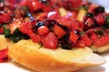 Traditional Italian sandwich Bruschetta with with tomato, olive oil, balsamic vinegar and herbs close up Royalty Free Stock Photo