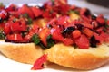 Traditional Italian sandwich Bruschetta with with tomato, olive oil, balsamic vinegar and herbs close up Royalty Free Stock Photo