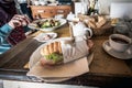 Traditional Italian sandwich with cup of coffee on breakfast table. Royalty Free Stock Photo