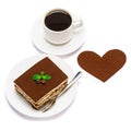 Traditional Italian Tiramisu square dessert portion on ceramic plate, cup of fresh hot espresso coffee and heart shape Royalty Free Stock Photo