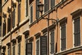 Traditional Italian windows with shutters in one of the houses o