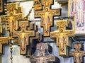 Traditional Italian wood carved crucifix display in souvenir shop.