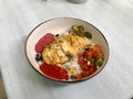 Traditional Jamaican Food Bowl with Chicken, Red Kidney Beans, Beet Sauce, Basmati Rice Pilaf, Avocado Guacamole, Jalapeno Pepper