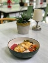 Traditional Jamaican Food Bowl with Chicken, Red Kidney Beans, Beet Sauce, Basmati Rice Pilaf, Avocado Guacamole, Jalapeno Pepper