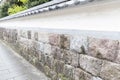 Traditional japan stone wall or fence of home Royalty Free Stock Photo