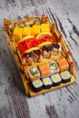 Traditional Japanese cuisine. A great set of different types of sushi. Restaurant presentation of food