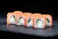 Traditional Japanese cuisine. Philadelphia sushi rolls with salm Royalty Free Stock Photo