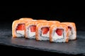 Traditional Japanese cuisine. Sweet sushi rolls with salmon, cre Royalty Free Stock Photo