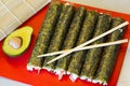 Traditional Japanese dish - sushi jr rolls wraped in green nori algae Royalty Free Stock Photo