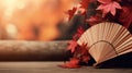 Traditional Japanese fan with red autumn leaves, fall vibes background Royalty Free Stock Photo