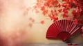 Traditional Japanese fan with red autumn leaves, fall vibes background Royalty Free Stock Photo