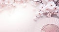 Traditional Japanese fan sensu in pink sakura blossom, spring vibes background