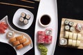 Traditional Japanese food - sushi, rolls, rice with shrimp and udon noodles on a dark background. Top view Royalty Free Stock Photo