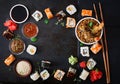 Traditional Japanese food - sushi, rolls, rice with shrimp and sauce on a dark background. Royalty Free Stock Photo