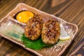 Traditional Japanese grilled chicken, Yakitori, with marinated egg yolk