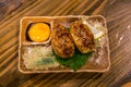 Traditional Japanese grilled chicken, Yakitori, with marinated egg yolk