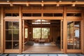 traditional japanese house with wooden exterior and sliding screen doors