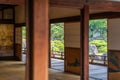 Traditional japanese interior, green zen garden outside
