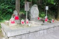 Traditional Japanese Jizo Statues Adorned With Red Bibs at Kiyomizudera Temple