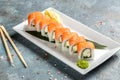 Traditional Japanese kitchen, delicious fresh sushi roll set. Sushi roll with rice, cream chees, red fish, salmon. Sushi menu, Royalty Free Stock Photo