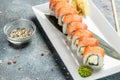 Traditional Japanese kitchen, delicious fresh sushi roll set. Sushi roll with rice, cream chees, red fish, salmon. Sushi menu, Royalty Free Stock Photo