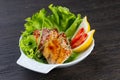 traditional Japanese salad of seaweed eel in balsamic dressing. garnished with white sesame seeds and a lemon wedge. spicy salad Royalty Free Stock Photo