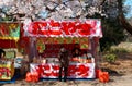 Traditional Japanese snack stalls Yatai, Roten under vibrant cherry blossom trees in Sakura Matsuri festival