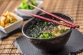 Traditional japanese soup Miso with tofu seaweed chopsticks and