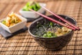 Traditional japanese soup Miso with tofu seaweed chopsticks and