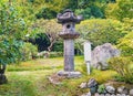 Traditional japanese stone lantern in the park near Kyoto