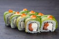 traditional Japanese sushi with salmon avocado and soft cheese garnished with red caviar. Japanese kitchen. Japanese restaurant Royalty Free Stock Photo