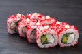 traditional Japanese sushi with salmon avocado and soft cheese garnished with red caviar. Japanese kitchen. Japanese restaurant Royalty Free Stock Photo